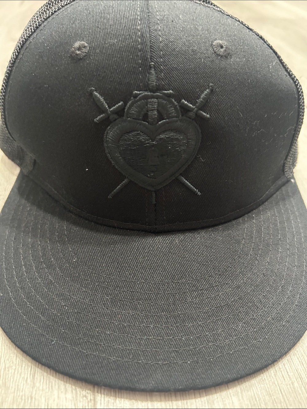 Black Trucker Hat with Embroidered Heart and Daggers